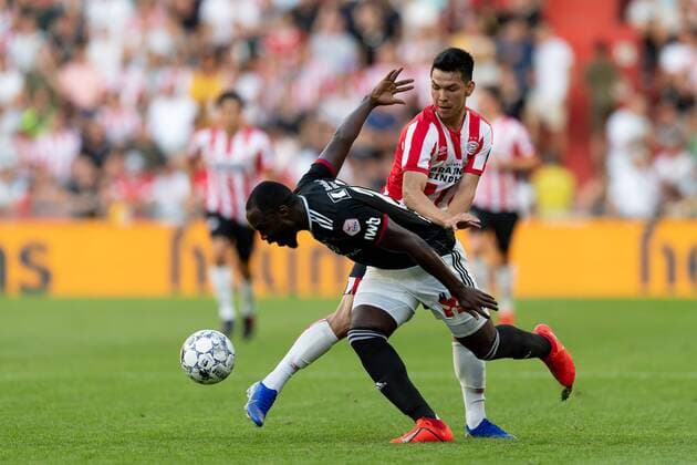 Eindhoven, Netherlands, 24 07 2019, UEFA Champions League, Second qualifying round, PSV Eindhoven FC Basel , Eder Balanta Basel and Hirving Lozano PSV in the total Defodi 01061003754 Defodi-061
