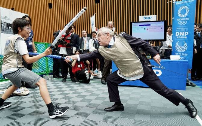 Sport Themen der Woche KW30 Sport Bilder des Tages One year to 2020 Tokyo Olympics International Olympic Committee President Thomas Bach (R) fences at a promotional event in Tokyo on July 24, 2019, for the 2020 Olympics in the Japanese capital. The day marked the start of the one-year countdown to the opening of the Olympics. (Pool photo) 