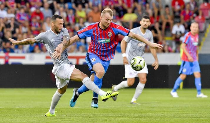 L-R Guilherme (Piraeus) and Michael Krmencik (Plzen) in action during the Football Champions League 2nd qualifying round match: Viktoria Plzen vs Olympiakos Piraeus in Pilsen, Czech Republic, on July 23, 2019. (CTKxPhoto VitxSimanek) CTKPhotoP201907230949701  VIS 006
