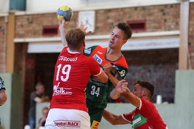 Michael Damgaard SC Magdeburg vs. Markus Stegefelt TV Hüttenberg Handball test game summer preparation season 2019 2020 points game SC Magdeburg vs. TV Hüttenberg in the Franz Vollbring Halle in Schönebeck Aktion,Deutschland, Handball, Mann, Maenner,23 07 2019