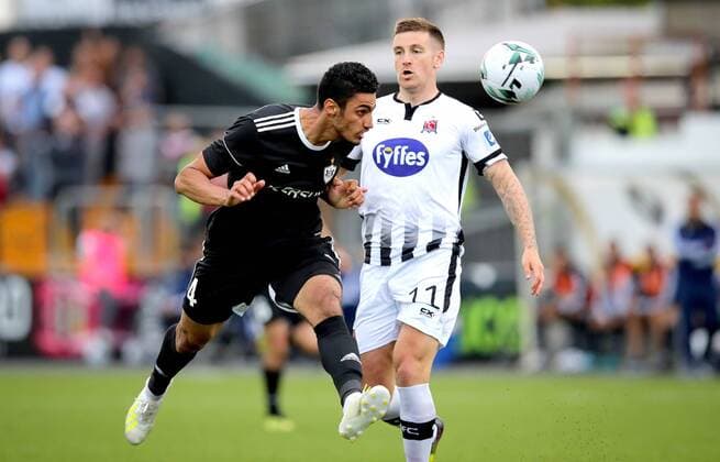 UEFA Champions League Second Qualifying Round First Leg, Oriel Park, Co. Louth 24 7 2019 Dundalk vs Qarabag Dundalk s Patrick McEleney and Simeon Slavchev of Qarabag Patrick McEleney and Simeon Slavchev 24 7 2019  Copyright: x©INPHO RyanxByrnex RB3_5698