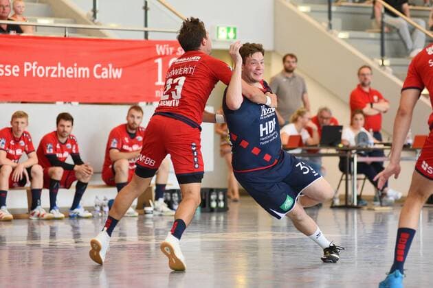 Joshua Stoeffler SG H2Ku Herrenberg 32 against Jan Asmuth SG BBM Bietigheim 23 Handball , men , preparation , tournament, Altensteig , S Cup , 27 07 2019, photo TBaur Eibner S Cup SG H2Ku Herrenberg SG BBM Bietigheim Altensteig Copyright: xEIBNER TobiasxBaurx EP_TBR