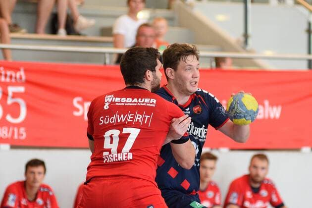 Joshua Stoeffler SG H2Ku Herrenberg 32 against Jonathan Fischer SG BBM Bietigheim 97 Handball , men , preparation , tournament, Altensteig , S Cup , 27 07 2019, photo TBaur Eibner S Cup SG H2Ku Herrenberg SG BBM Bietigheim Altensteig Copyright: xEIBNER TobiasxBaurx EP_TBR