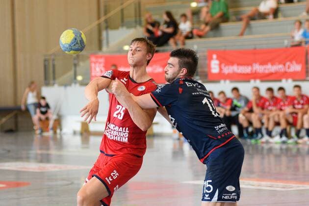 Maximilian Trost SG BBM Bietigheim 25 against Maximilian Fuhrmann SG H2Ku Herrenberg 15 Handball , men , preparation , tournament, Altensteig , S Cup , 27 07 2019, photo TBaur Eibner S Cup SG H2Ku Herrenberg SG BBM Bietigheim Altensteig Copyright: xEIBNER TobiasxBaurx EP_TBR