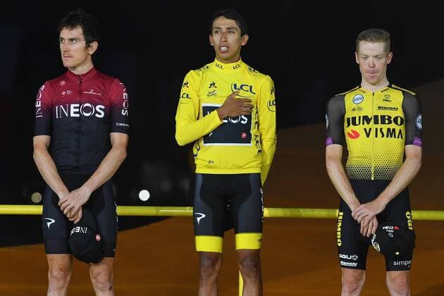 L-R, second, British Geraint Thomas of Team Ineos, winner Colombian Egan Bernal of Team Ineos wearing the yellow jersey and third Dutch Steven Kruijswijk of Team Jumbo-Visma celebrate on the podium of the general ranking after the final stage of the 106th edition of the Tour de France cycling race, from Rambouillet to Paris Champs-Elysees (128km), France, Sunday 28 July 2019. This year s Tour de France starts in Brussels and takes place from July 6th to July 28th. DAVIDxSTOCKMAN  x05635268x