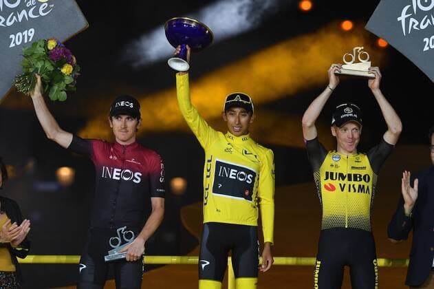 L-R, second, British Geraint Thomas of Team Ineos, winner Colombian Egan Bernal of Team Ineos wearing the yellow jersey and third Dutch Steven Kruijswijk of Team Jumbo-Visma celebrate on the podium of the general ranking after the final stage of the 106th edition of the Tour de France cycling race, from Rambouillet to Paris Champs-Elysees (128km), France, Sunday 28 July 2019. This year s Tour de France starts in Brussels and takes place from July 6th to July 28th. DAVIDxSTOCKMAN  x05635289x