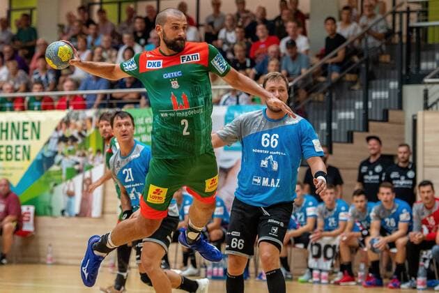 Zeljko Musa SC Magdeburg at the goal throw SC Magdeburg vs. MAT Pilsen at the BWG Handball Day in the Erdgas Sportarena Halle Saale Sachsen Anhalt Germany