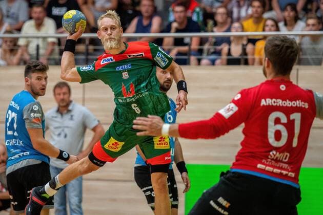 Matthias Musche SC Magdeburg once again overcomes the goalkeeper of Pilsen SC Magdeburg vs. MAT Pilsen at the BWG Handballtag in the Erdgas Sportarena Halle Saale Sachsen Anhalt Germany
