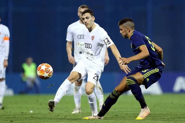 (190731) -- ZAGREB, July 31, 2019 -- Dino Peric (R) of GNK Dinamo Zagreb vies with Ognien Rololic of FC Saburtalo Tbilisi during the second leg of second qualifying round match of UEFA Champions League in Zagreb, Croatia, July 30, 2019. GNK Dinamo won 3-0. ( Pixsell via Xinhua) (SP)CROATIA-ZAGREB-UEFA CHAMPIONS LEAGUE-DINAMO ZAGREB VS SABURTALO TBILISI LukaxStanzl 