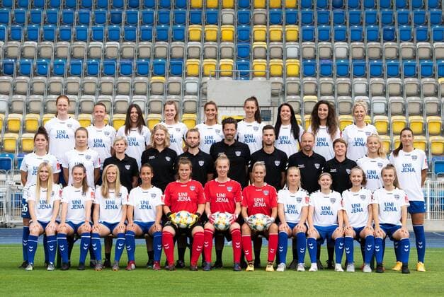 Team photo session Season 2019 2020 FLYERALARM Women Bundesliga 31 7 2019 FF USV Jena behind v li Svenja Paulsen, Jena Sedlácková, Leonie Kreil, Anja Heuschkel, Jalila Dalaf, Anna Weiß, Lisa Seiler, Julia Arnold, Isabelle Knipp Mitte v li Tina Kremlitschka, Christin Meyer, Saskia Schwarz Teammanagerin , Anita Poppe Physiotherapeutin , Thilo Osterbrink Co Trainer , Christopher Heck Head Coach , Martin Buder Individual Reha Coach , Stephan Fleischhauer Goalkeeper Coach , Susann Utes Co Trainer , Maren Tellenbröker, Merza Julevic in front from Julie Karn, Pia Große, Jitka Chlastáková, Nelly Juckel, Laura Kiontke, Sarah Hornschuch, Inga Schuldt, Any Adam, Vanessa Fudalla, Donika Grajqevci, Annika Graser Missing Karla Görlitz Ernst Abbe Sportfeld