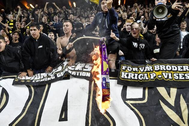 AIK supporters set a Maribor scarf on fire during the UEFA Champions League second qualifying round leg 2 soccer match between AIK and NK Maribor Slovenia at Friends Arena in Stockholm, Sweden, on July 31,2019 Stockholm SWEDEN SOCCER x11880x,  Copyright: xNainaxHelenxJama TTx KVAL CHAMPIONS LEAGUE AIK-MARIBOR