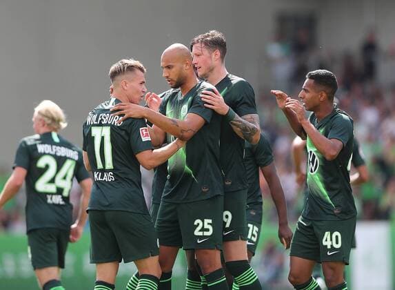 Goal celebration 1 0 by Felix Klaus VfL Wolfsburg , congratulations John Anthony Brooks VfL Wolfsburg and Wout Weghorst VfL Wolfsburg DFL REGULATIONS PROHIBIT ANY USE OF PHOTOGRAPHS AS IMAGE SEQUENCES AND OR QUASI VIDEO