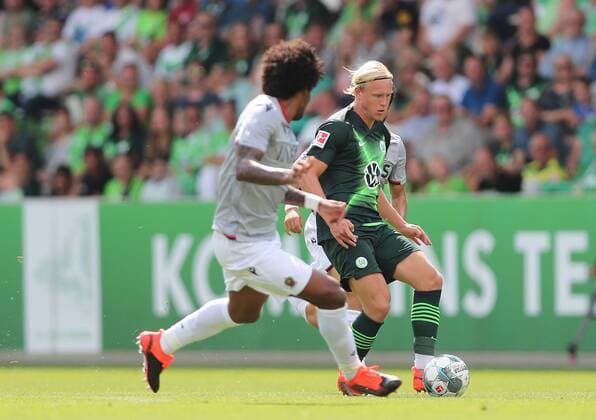 Xaver Schlager VfL Wolfsburg in duel with Dante nizza DFL REGULATIONS PROHIBIT ANY USE OF PHOTOGRAPHS AS IMAGE SEQUENCES AND OR QUASI VIDEO