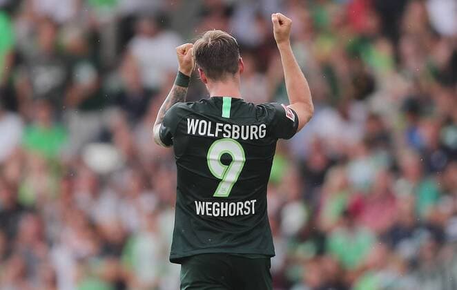 Goal celebration 2 1 by Wout Weghorst VfL Wolfsburg DFL REGULATIONS PROHIBIT ANY USE OF PHOTOGRAPHS AS IMAGE SEQUENCES AND OR QUASI VIDEO