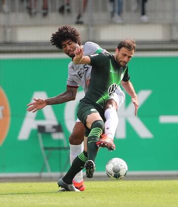 Renato Steffen VfL Wolfsburg in duel with Dante Nizza DFL REGULATIONS PROHIBIT ANY USE OF PHOTOGRAPHS AS IMAGE SEQUENCES AND OR QUASI VIDEO