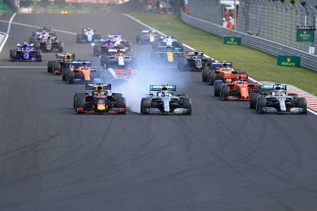 4th August 2019, Hungaroring Circuit, Mogyorod, Budapest, Hungary; Formula 1 Rolex Hungary Grand Prix; Race Day; Aston Martin Red Bull Racing, Max Verstappen, Mercedes AMG Petronas Motorsport, Valtteri Bottas locks up into turn 1 with his team mate Lewis Hamilton alongside  ActionPlus12158006 Octane