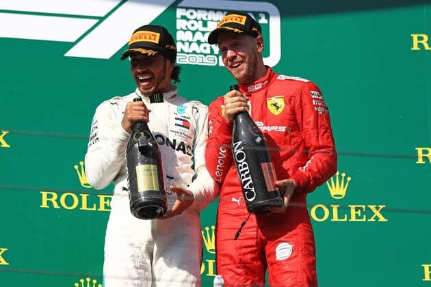 4th August 2019, Hungaroring Circuit, Mogyorod, Budapest, Hungary; Formula 1 Rolex Hungary Grand Prix; Race Day; Mercedes AMG Petronas Motorsport, Lewis Hamilton wins in Budapest and shares a laugh with Scuderia Ferrari, Sebastian Vettel  ActionPlus12158092 Octane