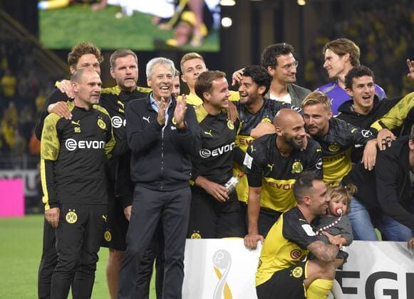03 08 2019, Football 2019 2020, Supercup 2019, Borussia Dortmund FC Bayern Munich, at Signal Iduna Park Stadion Dortmund, award ceremony,Dortmund celebrates Supercup win, coach Lucien Favre 4 v left, Dortmund cheers with team DFL and DFB regulations prohibit any use of photographs as image sequences and or quasi video