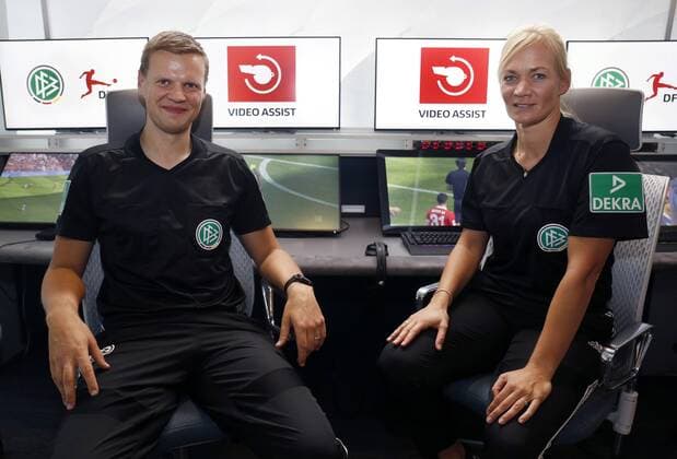 Cologne, Germany, 05 08 2019 DFB referee Bibiana STEINHAUS re and her colleague Thorben SIEWER li in front of the monitors in the redesigned and expanded Video Assist Center VAC in the Cologne Broadcasting Center in Cologne