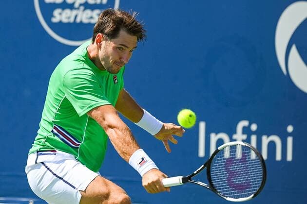 MONTREAL, QC - AUGUST 05: Dusan Lajovic (SRB) returns the ball during the ATP, Tennis Herren Coupe Rogers first round match on August 5, 2019 at IGA Stadium in Montreal, QC (Photo by David Kirouac Icon Sportswire) TENNIS: AUG 05 Coupe Rogers Icon190805064