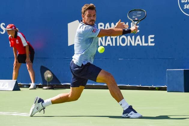 MONTREAL, QC - AUGUST 05: Stan Wawrinka (SUI) returns the ball during the ATP, Tennis Herren Coupe Rogers first round match on August 5, 2019 at IGA Stadium in Montreal, QC (Photo by David Kirouac Icon Sportswire) TENNIS: AUG 05 Coupe Rogers Icon190805072