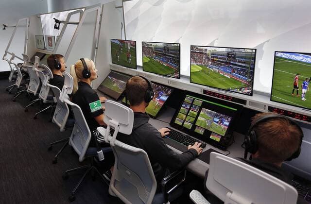 Cologne, Germany, 05 08 2019 DFB referee Bibiana STEINHAUS 2 from left and her colleague Thorben SIEWER from left watch together with the video operators scenes of a soccer Bundesliga match on the monitors of the redesigned and expanded Video Assist Center VAC in the Cologne Broadcasting Center in Cologne
