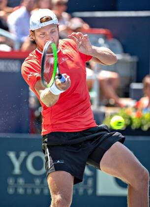 (190806) -- MONTREAL, Aug. 6, 2019 (Xinhua) -- Lucas Pouille of France returns the ball during the first round of men s singles match against Milos Raonic of Canada at the 2019 Rogers Cup in Montreal, Canada, Aug. 5, 2019. (Xinhua Andrew Soong) (SP)CANADA-MONTREAL-TENNIS-ROGERS CUP-MEN S SINGLES 