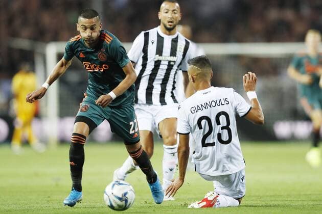 (l-r) Hakim Ziyech of Ajax, Dimitris Giannoulis of PAOK FC during the UEFA Champions League third round qualifying first leg match between PAOK FC and Ajax Amsterdam at Toumba stadium on August 06, 2019 in Thessaloniki, Greece UEFA Champions League 2019 2020 xVIxVIxImagesx xMauricexvanxSteenxIVx 200757224