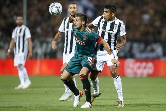 (190807) -- THESSALONIKI, Aug. 7, 2019 -- Ajax s Dusan Tadic (2nd R) vies with PAOK s Leo Matos (1st R) during the first leg of third qualifying round match of UEFA Champions League between PAOK Thessaloniki and Ajax at Toumpa Stadium in Thessaloniki, Greece, on Aug. 6, 2019. ) (SP)GREECE-THESSALONIKI-SOCCER-UEFA CHAMPIONS LEAGUE-PAOK VS AJAX DimitrisxTosidis 