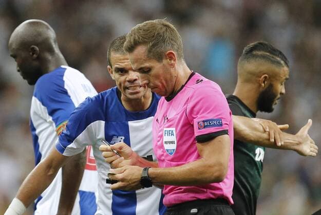 KRASNODAR, RUSSIA - AUGUST 7, 2019: Porto s Pepe (L) and chief referee Tobias Stieler in the 2019 20 UEFA Champions League third qualifying round match between FC Krasnodar and FC Porto at Krasnodar Stadium. Valery Matytsin TASS  TS0B5B3D