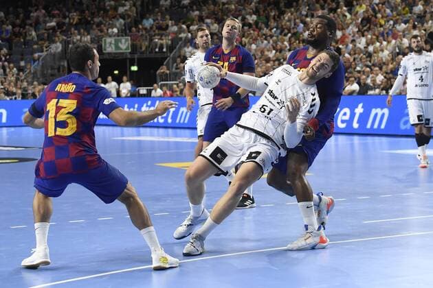 Handball THW Kiel vs. FC Barcelona on 11 08 2019 at the Lanxess Arena in Cologne Kiels Hendrik Pekeler No. 61 wins out in the circle WD