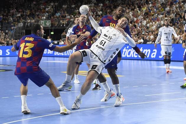 Handball THW Kiel vs. FC Barcelona on 11 08 2019 at the Lanxess Arena in Cologne Kiels Hendrik Pekeler No. 61 wins out in the circle WD