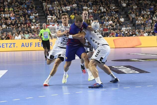 Handball THW Kiel vs. FC Barcelona on 11 08 2019 at the Lanxess Arena in Cologne Kiels Rune Dahmke Nr 23 and Kiel Pavel Horak Nr 28 stop Barcelona Victor Tomas Nr 8 WD