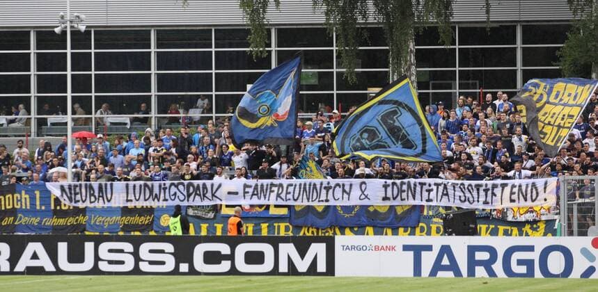 11 08 2019, xklex, Football Regionalliga Suedwest, 1 FC Saarbruecken Jahn Regensburg emspor, v l The fans of 1 FC Saarbrücken with a banner DFL DFB REGULATIONS PROHIBIT ANY USE OF PHOTOGRAPHS as IMAGE SEQUENCES and or QUASI VIDEO Voelklingen