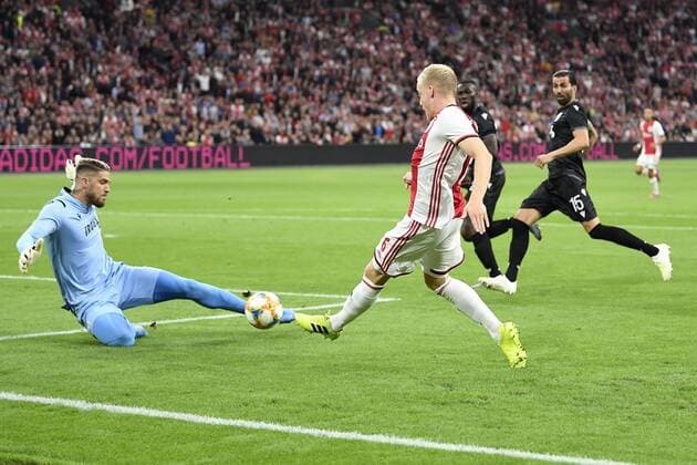 AMSTERDAM , 13-08-2019 , Johan Cruijff ArenA , Champions League third qualifying round season 2019-2020 , PAOK goalkeeper Alexandros Paschalakis and Ajax player Donny van de Beek during the match Ajax - PAOK Ajax - PAOK  x4105240x Copyright: