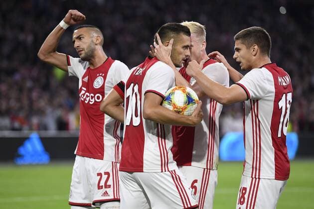 AMSTERDAM , 13-08-2019 , Johan Cruijff ArenA , Champions League third qualifying round season 2019-2020 , Ajax player Hakim Ziyech, Ajax player Dusan Tadic, Ajax player Donny van de Beek, Ajax player Razvan Marin celebrating the 1-1 during the match Ajax - PAOK Ajax - PAOK  x4105426x Copyright: