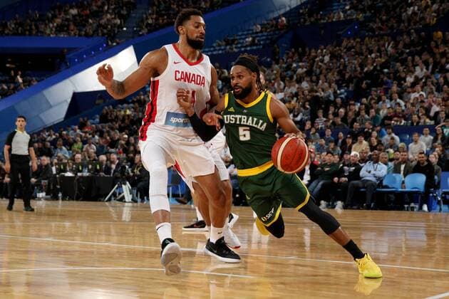 BASKETBALL AUSTRALIA CANADA, Patty Mills (right) of the Boomers drives past Khem Birch of Canada during the first Australia v Canada basketball match at RAC Arena in Perth, Friday, August 16, 2019. ( NO ARCHIVING, EDITORIAL USE ONLY, NO USE IN BOOKS WITHOUT CONSENT PERTH WA AUSTRALIA  Copyright: xRICHARDxWAINWRIGHTx 20190816001413553902