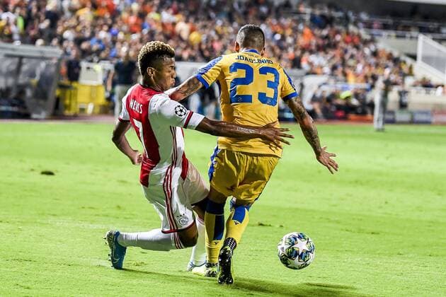 NICOSIA , 20-08-2019 , GSP Stadium , Champions League playoff, season 2019-2020 , Ajax player David Neres, APOEL Nicosia player Joaozinho during the match APOEL Nicosia - Ajax APOEL Nicosia - Ajax  x4149871x Copyright: