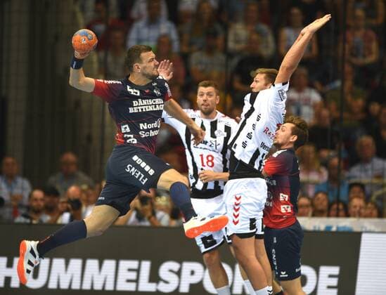 Handball Supercup THW Kiel SG Flensburg Handewitt on 21 08 2019 in Düsseldorf Michal Jurecki Flensb throws in front of Harald Reinkind Kiel HM