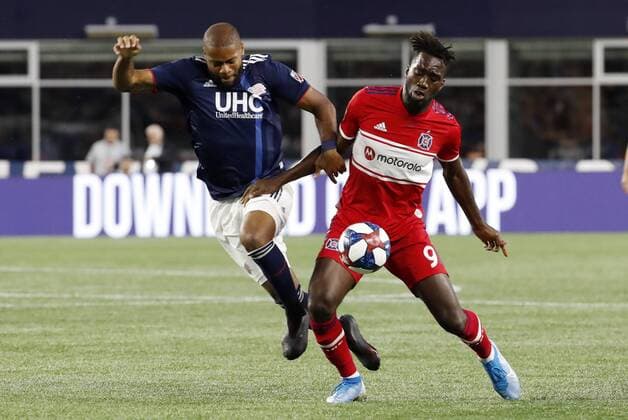 FOXBOROUGH, MA - AUGUST 24: New England Revolution defender Andrew Farrell (2) battles Chicago Fire forward CJ Sapong (9) for the ball during a match between the New England Revolution and the Chicago Fire on August 24, 2019, at Gillette Stadium in Foxborough, Massachusetts. (Photo by Fred Kfoury III Icon Sportswire) SOCCER: AUG 24 MLS, Fussball Herren, USA - Chicago Fire at New England Revolution Icon482190824002