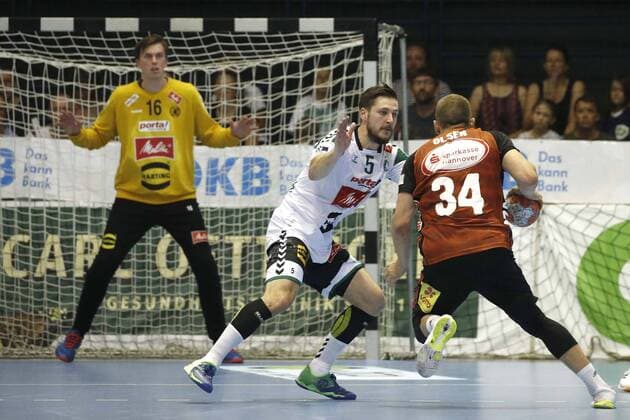 25 08 2019, Swiss Life Hall, Hannover, league game, 1 league, TSV Hannover Burgdorf vs. GWD Minden, in picture Joscha Rotterbach 5, Minden in duel with Morten Olsen 34, Han Burgdorf in front of the goal of Malte Semisch 16, Minden TSV Hannover Burgdorf vs. GWD Minden
