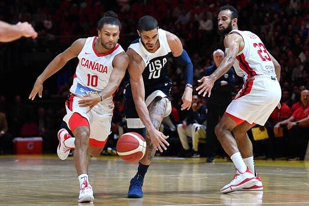 BASKETBALL CANADA USA, Jayson Tatum of the USA (centre) under pressure from Kaza Kajami-Keane of Canada (left) and Phil Scrubb of Canada (right) during the Pre-FIBA World Cup series match between Canada and the USA at Qudos Bank Arena in Sydney, Monday, August 26, 2019. ( NO ARCHIVING, EDITORIAL USE ONLY, NO USE IN BOOKS WITHOUT CONSENT SYDNEY NSW AUSTRALIA  Copyright: xDEANxLEWINSx 20190826001415009941