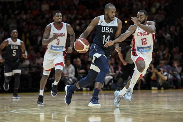 26th August 2019; Qudos Bank Arena, Sydney, New South Wales, Australia; International Basketball, United Sates of America Basketball versus Canada Basketball; Khris Middleton of USA dribbles the ball down the court under pressure from Aaron Best of Canada - Editorial Use Only.  ActionPlus12163468 NigelxOwen