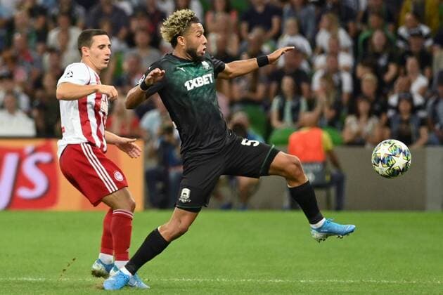 KRASNODAR, RUSSIA - AUGUST 27, 2019: Olympiacos FC s Daniel Podence (L) and FC Krasnodar s Tonny Vilhena in the sesond leg of the 2019-20 UEFA Champions League play-off football match between FC Krasnodar and Olympiacos FC at Krasnodar Stadium. Maxim Romanov TASS  TS0B8347