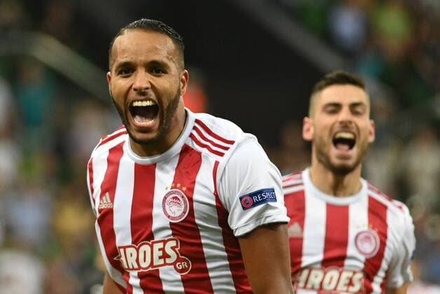 KRASNODAR, RUSSIA - AUGUST 27, 2019: Olympiacos FC s Youssef El Arabi (front) celebrates a goal in the senond leg of the 2019-20 UEFA Champions League play-off football match between FC Krasnodar and Olympiacos FC at Krasnodar Stadium; Olympiacos FC won 2-1. Maxim Romanov TASS  TS0B8366