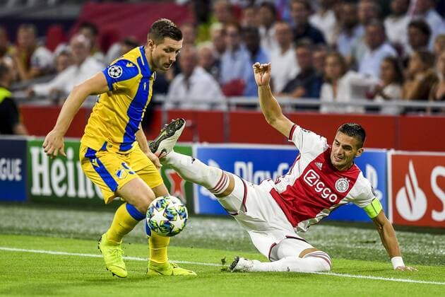 AMSTERDAM , 29-08-2019 , Johan Cruijff ArenA , Champions League playoff, season 2019-2020 , APOEL Nicosia player Dragan Mihajlovic, Ajax player Dusan Tadic during the match Ajax - APOEL Nicosia Ajax - APOEL Nicosia  x4211498x Copyright: