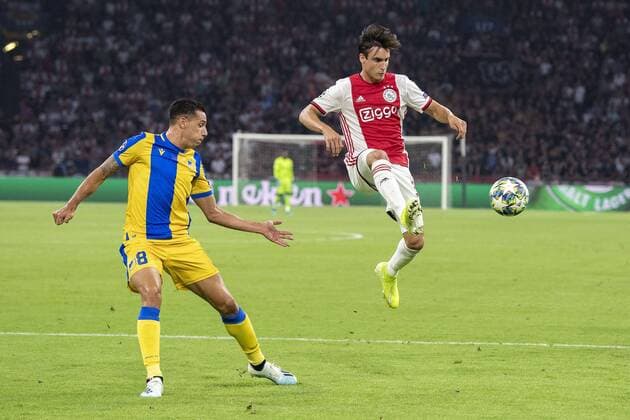 AMSTERDAM , 29-08-2019 , Johan Cruijff ArenA , Champions League playoff, season 2019-2020 , APOEL Nicosia player Lucas Souza and Ajax player Nico Tagliafico during the match Ajax - APOEL Nicosia Ajax - APOEL Nicosia  x4211728x Copyright: