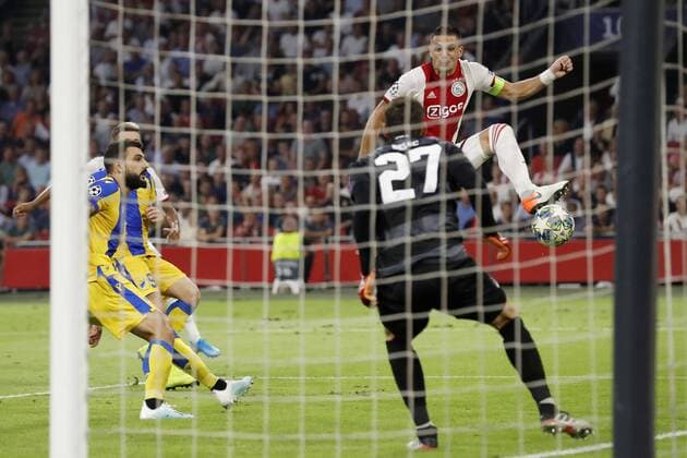 (L-R) Giorgos Merkis of APOEL FC, APOEL FC goalkeeper Vid Belec, Dusan Tadic of Ajax during the UEFA Champions League play off qualifying second leg match between Ajax Amsterdam and APOEL FC at the Johan Cruijff Arena on August 28, 2019 in Amsterdam, The Netherlands UEFA Champions League 2019 2020 xVIxVIxImagesx xMauricexvanxSteenxIVx 201351450