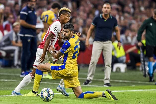 AMSTERDAM , 29-08-2019 , Johan Cruijff ArenA , Champions League playoff, season 2019-2020 , Ajax player David Neres, APOEL Nicosia player Joaozinho during the match Ajax - APOEL Nicosia Ajax - APOEL Nicosia  x4212099x Copyright: