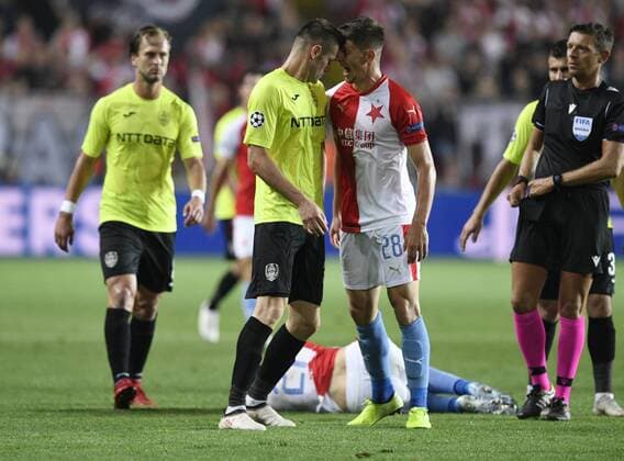 Sport Bilder des Tages From left ANDREI MURESAN of CFR Cluj and LUKAS MASOPUST of Slavia in action during the Football Champions League 4th qualifying round return match: Slavia Prague vs Cluj-Napoca in Sinobo Stadium, Prague, Czech Republic, August 28, 2019. (CTKxPhoto MichalxKamaryt) CTKPhotoP201908281011901  _KMT6693